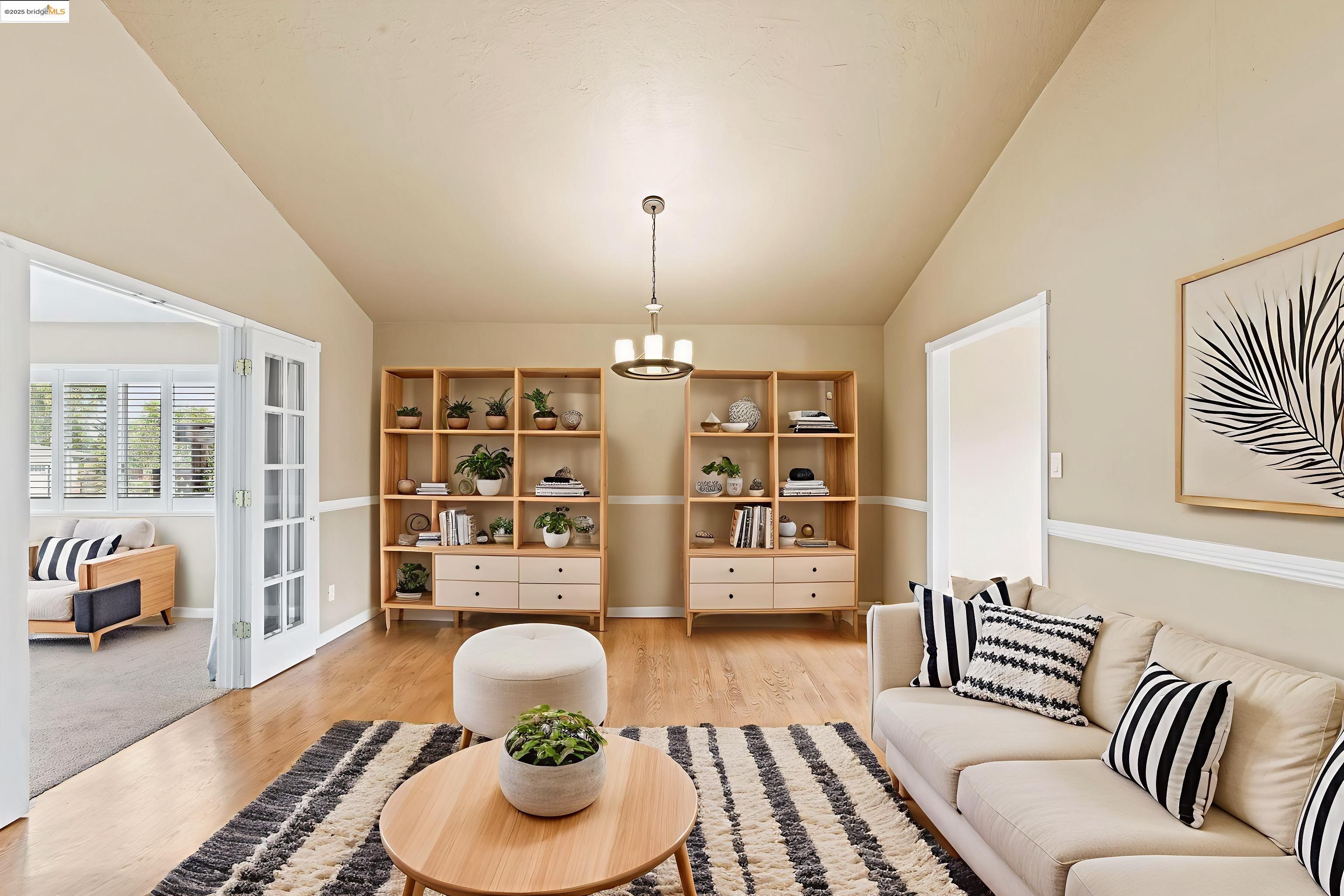 838 Hazel Street Livermore, CA 94550 - Photo 2 of 35 a living room with furniture or couch and a chandelier