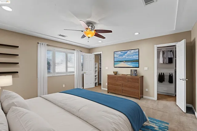 an empty room with a window and flowerpot