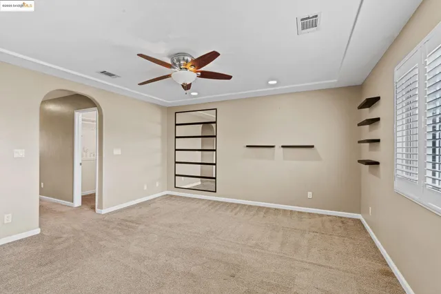 a bathroom with a sink a toilet and a window