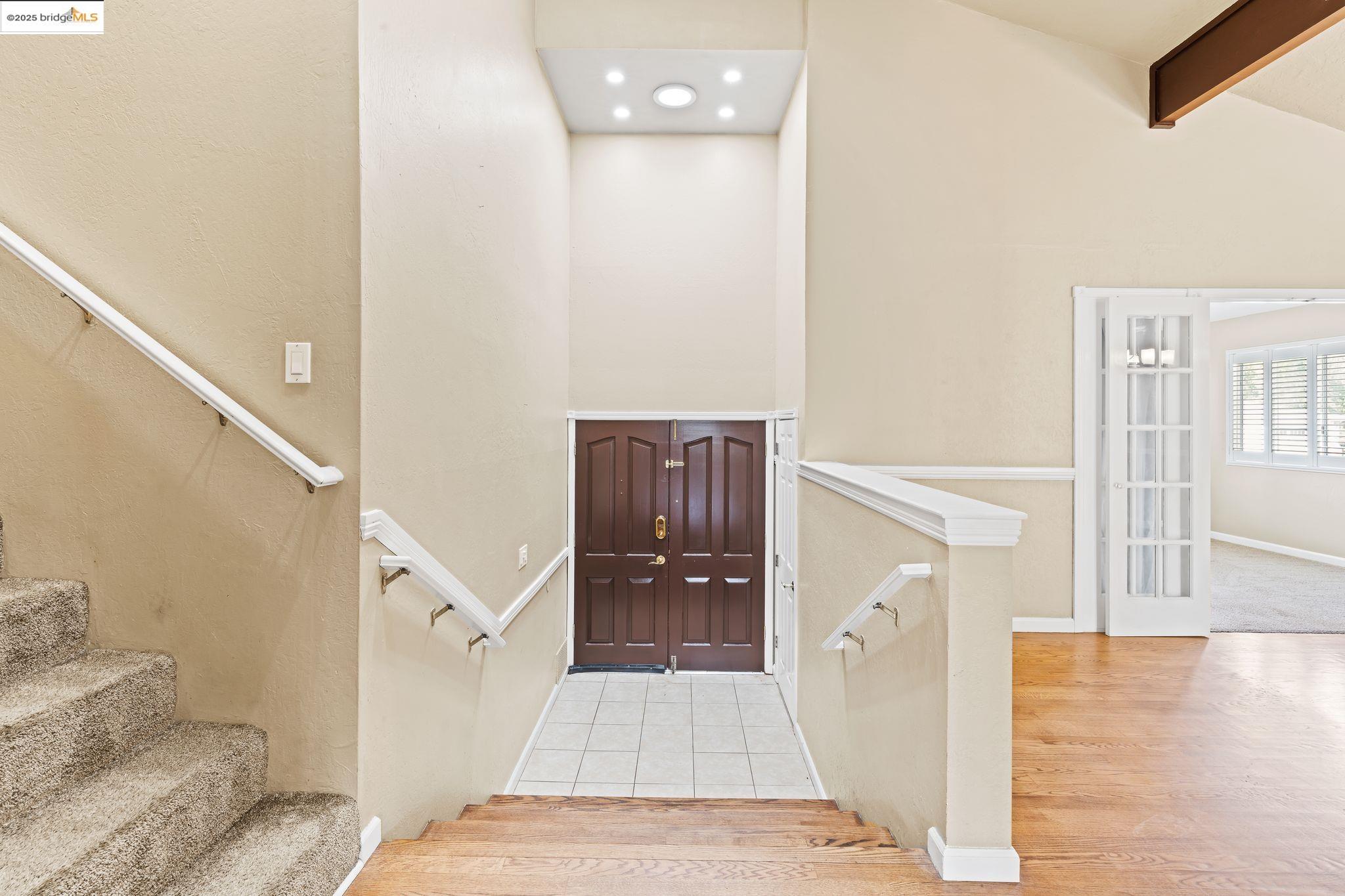 838 Hazel Street Livermore, CA 94550 - Photo 6 of 35 a view of a hallway view with wooden floor and staircase
