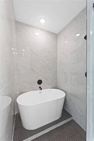 a bathroom with double sink and a mirror