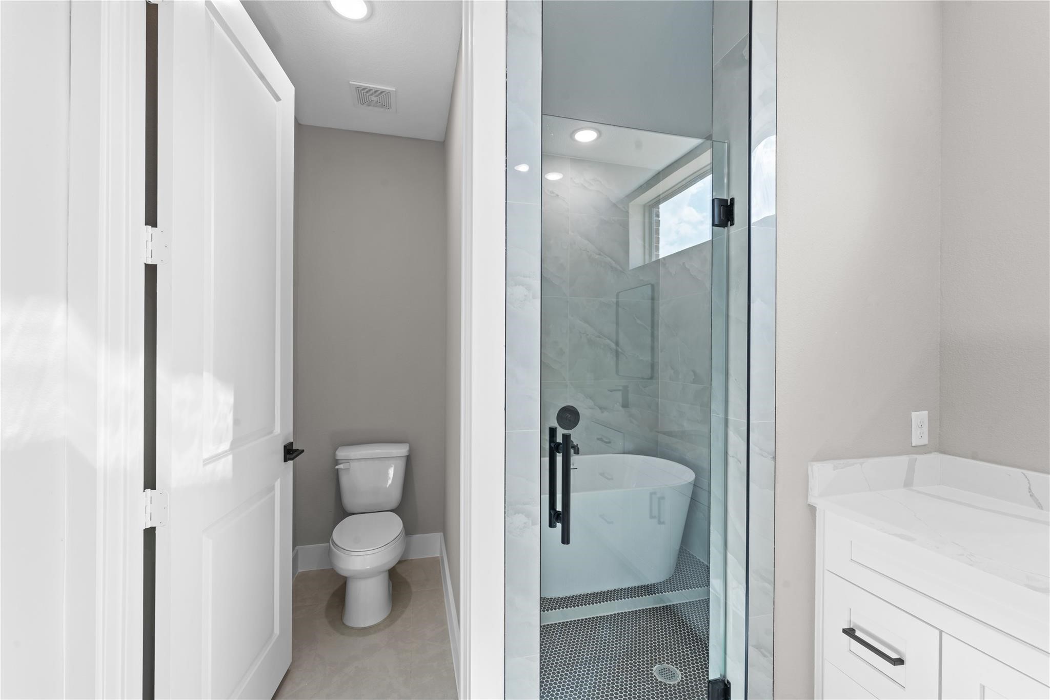 2515 Liguria Spring Spring, TX 77388 - Photo 14 of 17 a bathroom with a granite countertop toilet a sink and shower