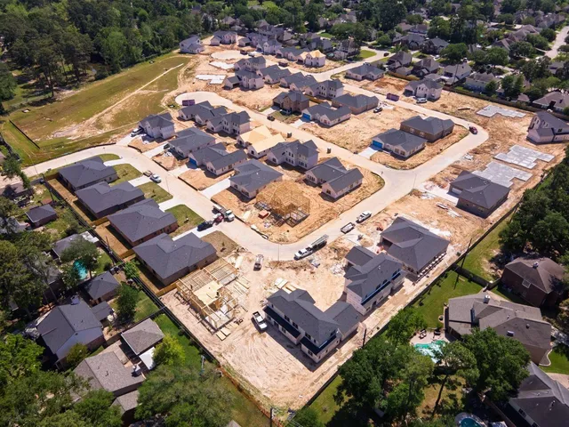 an aerial view of residential building with parking space