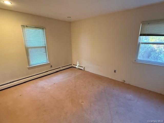 19 Carriage Road Roslyn, NY 11576 - Photo 11 of 19 an empty room with windows
