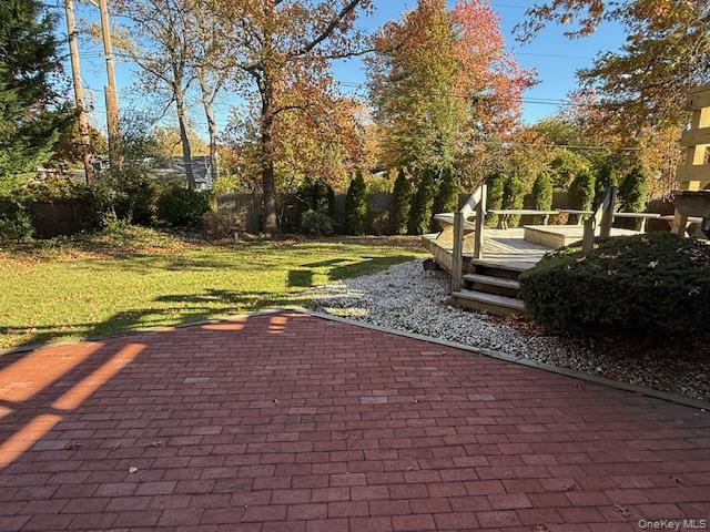 19 Carriage Road Roslyn, NY 11576 - Photo 17 of 19 a view of a yard with an outdoor space