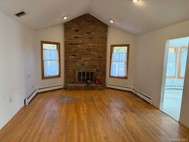 19 Carriage Road Roslyn, NY 11576 - Photo 5 of 19 an empty room with wooden floor fireplace and windows