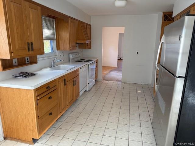 19 Carriage Road Roslyn, NY 11576 - Photo 6 of 19 a kitchen with stainless steel appliances a sink stove and refrigerator