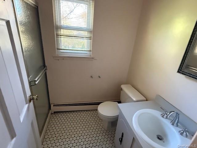 19 Carriage Road Roslyn, NY 11576 - Photo 10 of 19 a bathroom with a sink and a toilet