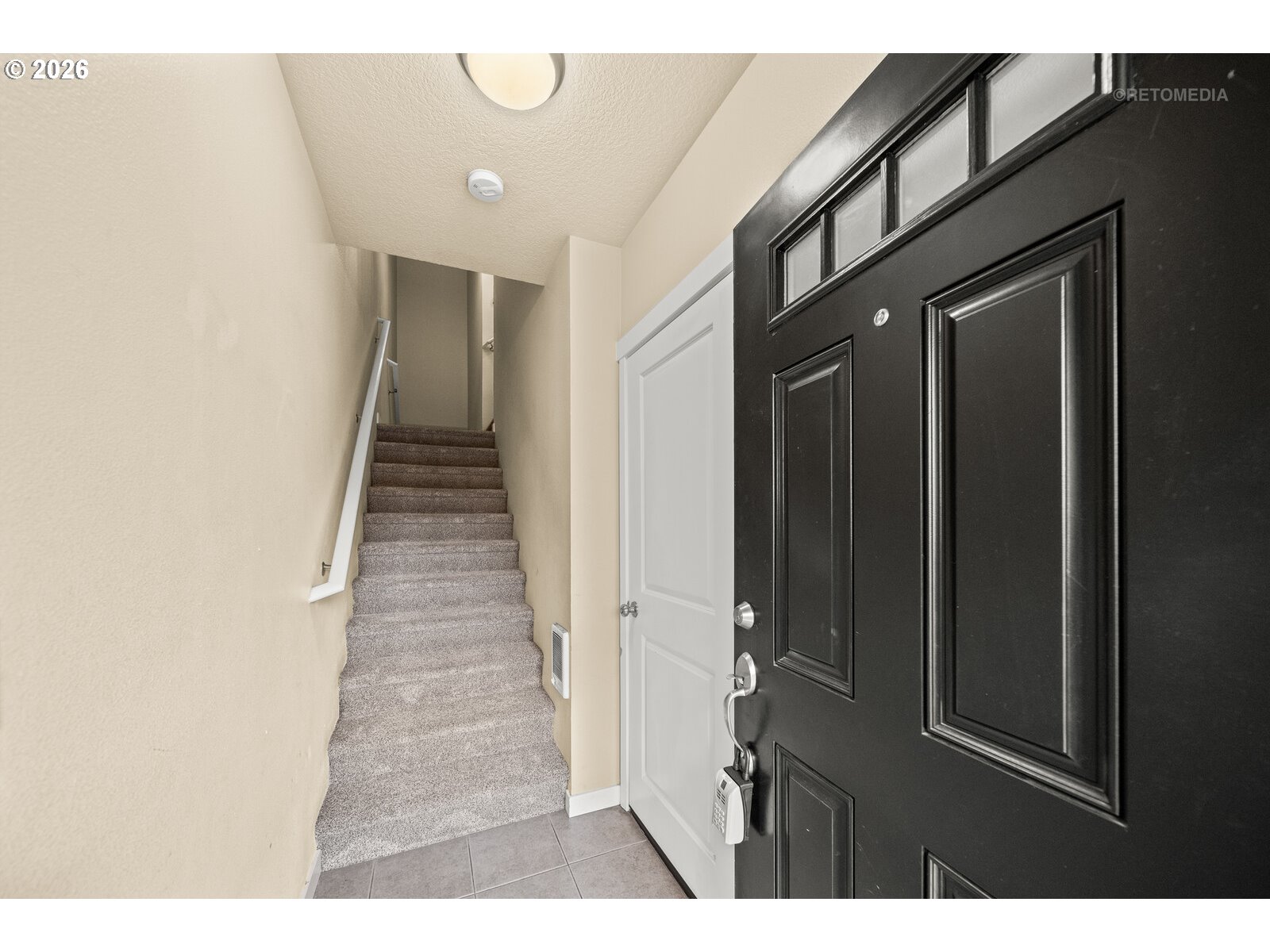 10442 Southwest Akilean Terrace Portland, OR 97223 - Photo 3 of 33 a view of a hallway with wooden floor and staircase