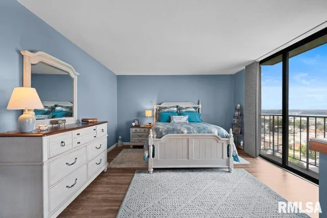 a bedroom with a large bed and a dresser