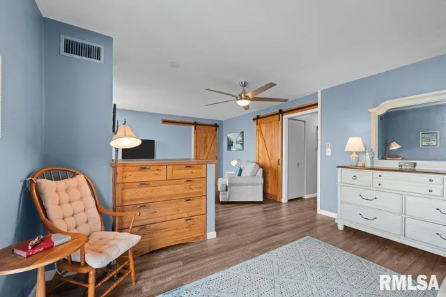 a bedroom with a bed and furniture