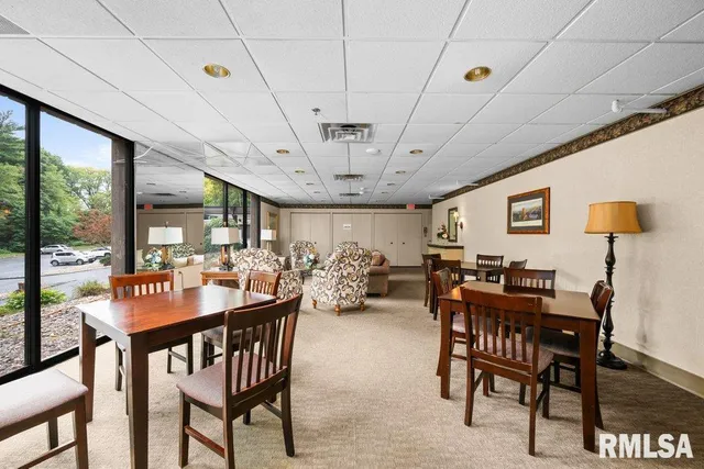 a view of a dining room with furniture window and outside view