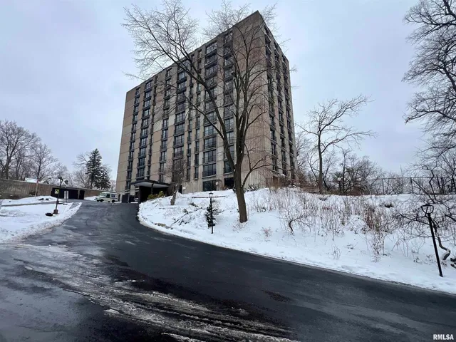 a view of roof with wooden fence
