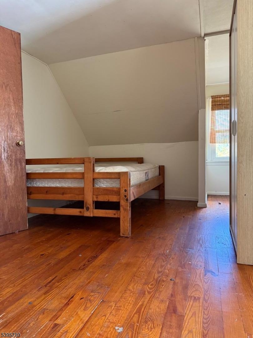 355 Metlars Lane Piscataway, NJ 08854 - Photo 22 of 26 a view of room with wooden floor and air conditioner