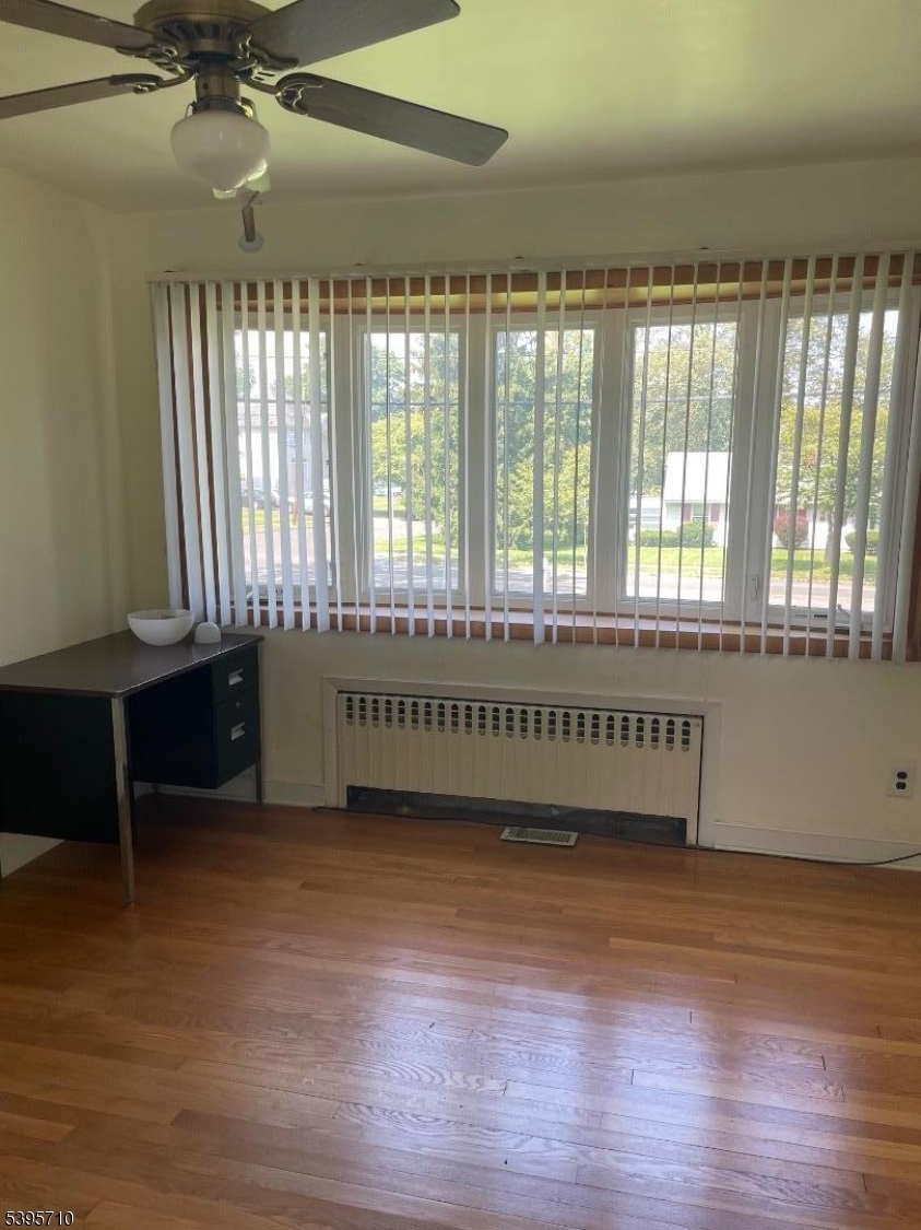 355 Metlars Lane Piscataway, NJ 08854 - Photo 6 of 26 a view of an empty room with a window