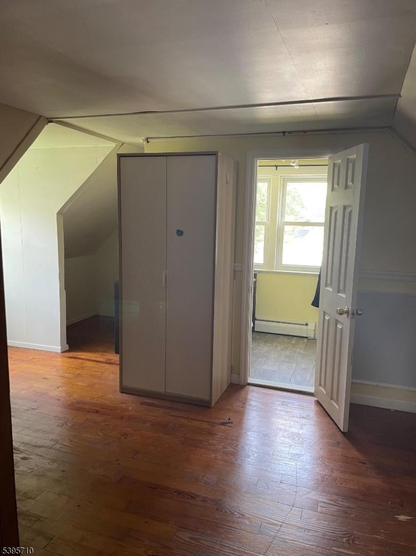 355 Metlars Lane Piscataway, NJ 08854 - Photo 7 of 26 a view of empty room with wooden floor