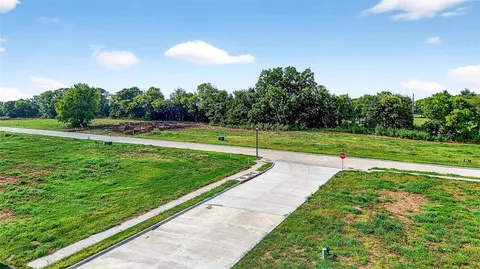 a view of outdoor space with trees all around