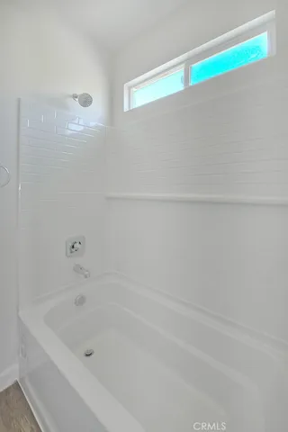 a bathroom with a sink vanity and mirror