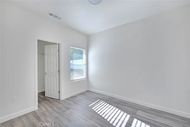 a bathroom with a bathtub shower sink vanity and toilet