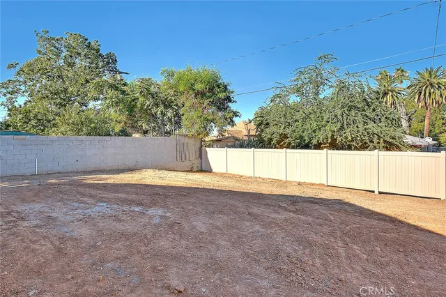 an aerial view of residential houses with city view