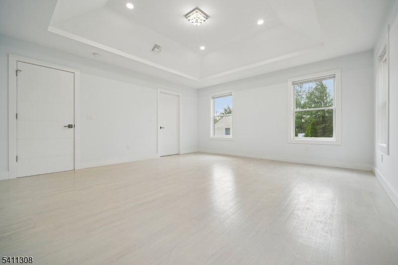 134 Hillside Avenue Livingston, NJ 07039 - Photo 11 of 25 an empty room with windows