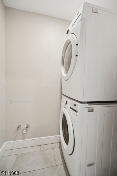 134 Hillside Avenue Livingston, NJ 07039 - Photo 18 of 25 a utility room with dryer and washer