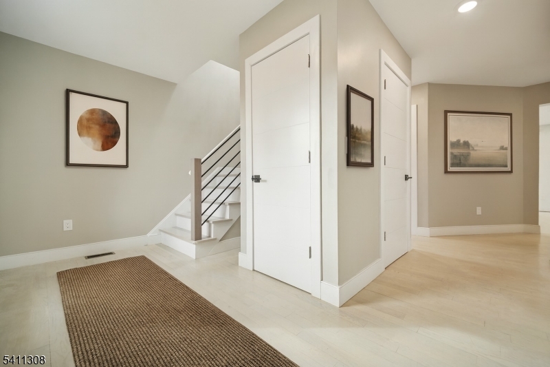 134 Hillside Avenue Livingston, NJ 07039 - Photo 2 of 25 a view of a hallway with staircase