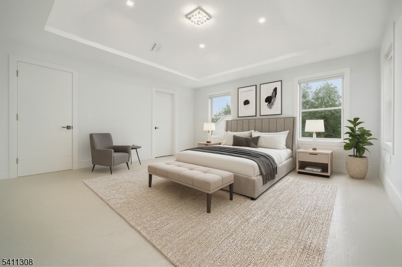 134 Hillside Avenue Livingston, NJ 07039 - Photo 7 of 25 a bedroom with bed and a couch