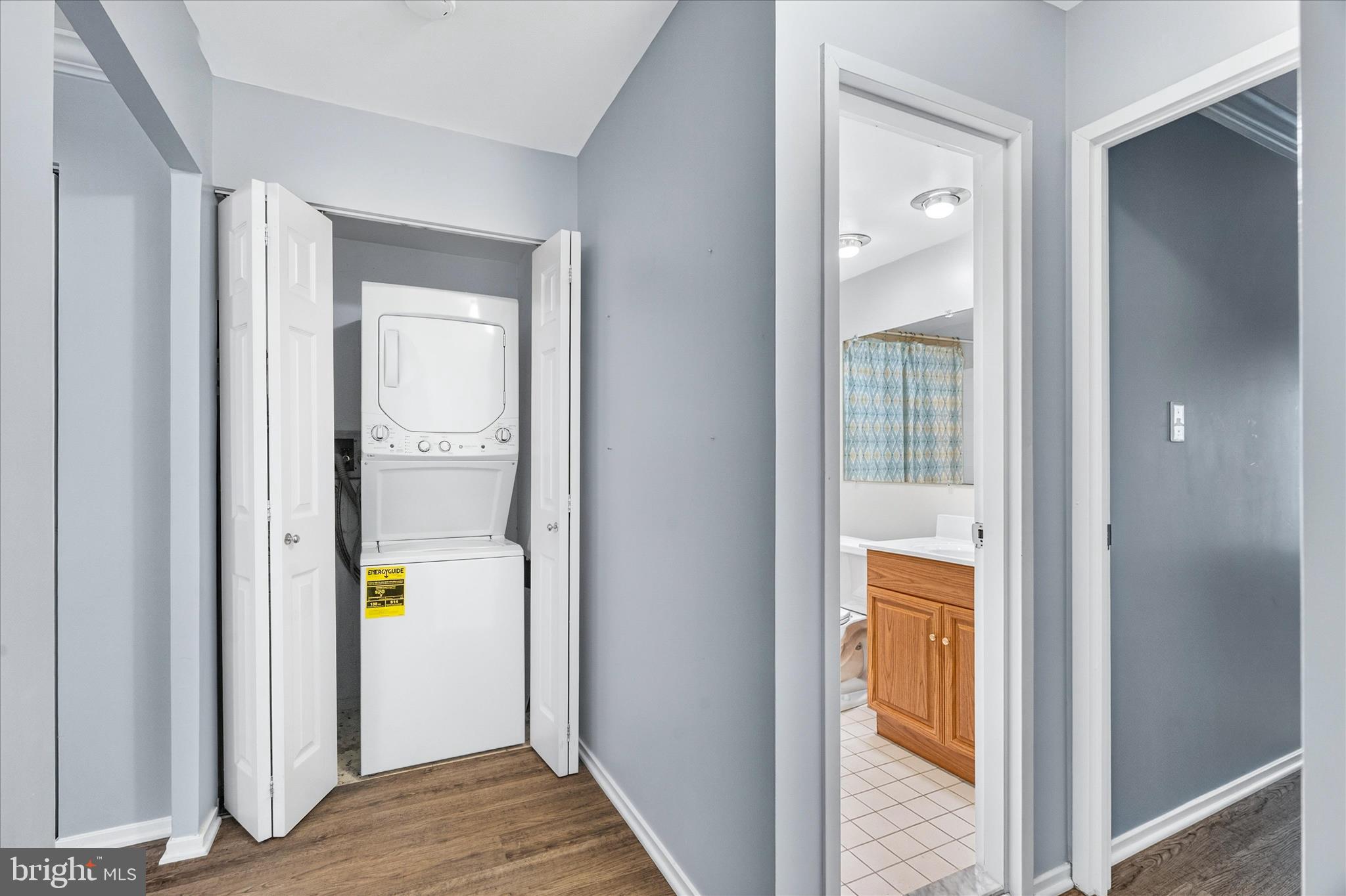 10000 Stedwick Road, Unit 104 Montgomery Village, MD 20886 - Photo 16 of 31 a view of an entryway of house and wooden floor