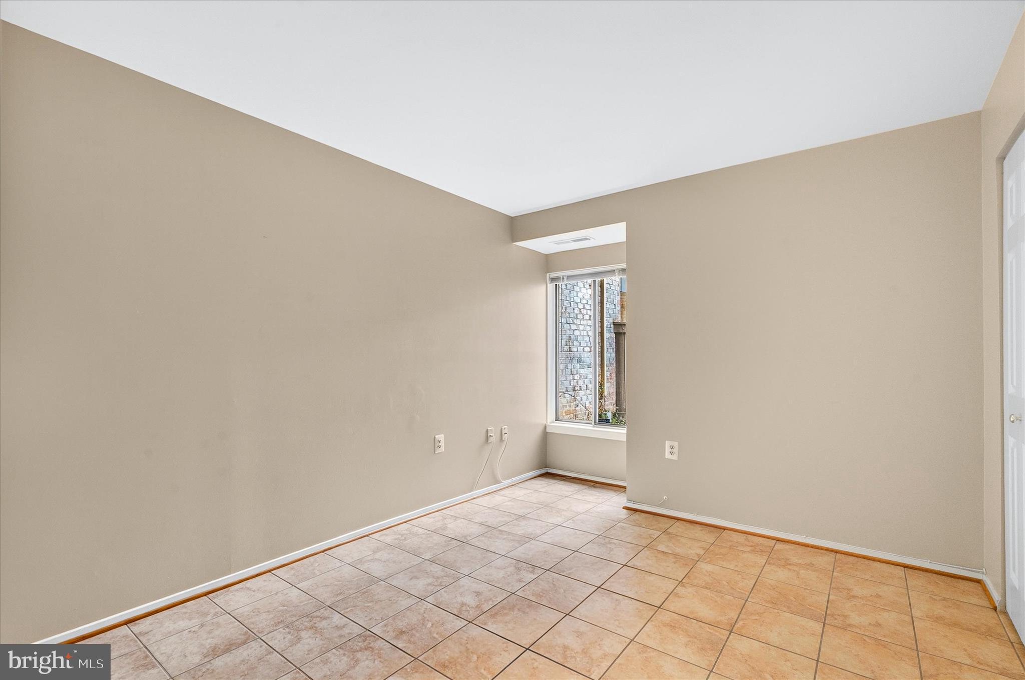 10000 Stedwick Road, Unit 104 Montgomery Village, MD 20886 - Photo 22 of 31 an empty room with windows