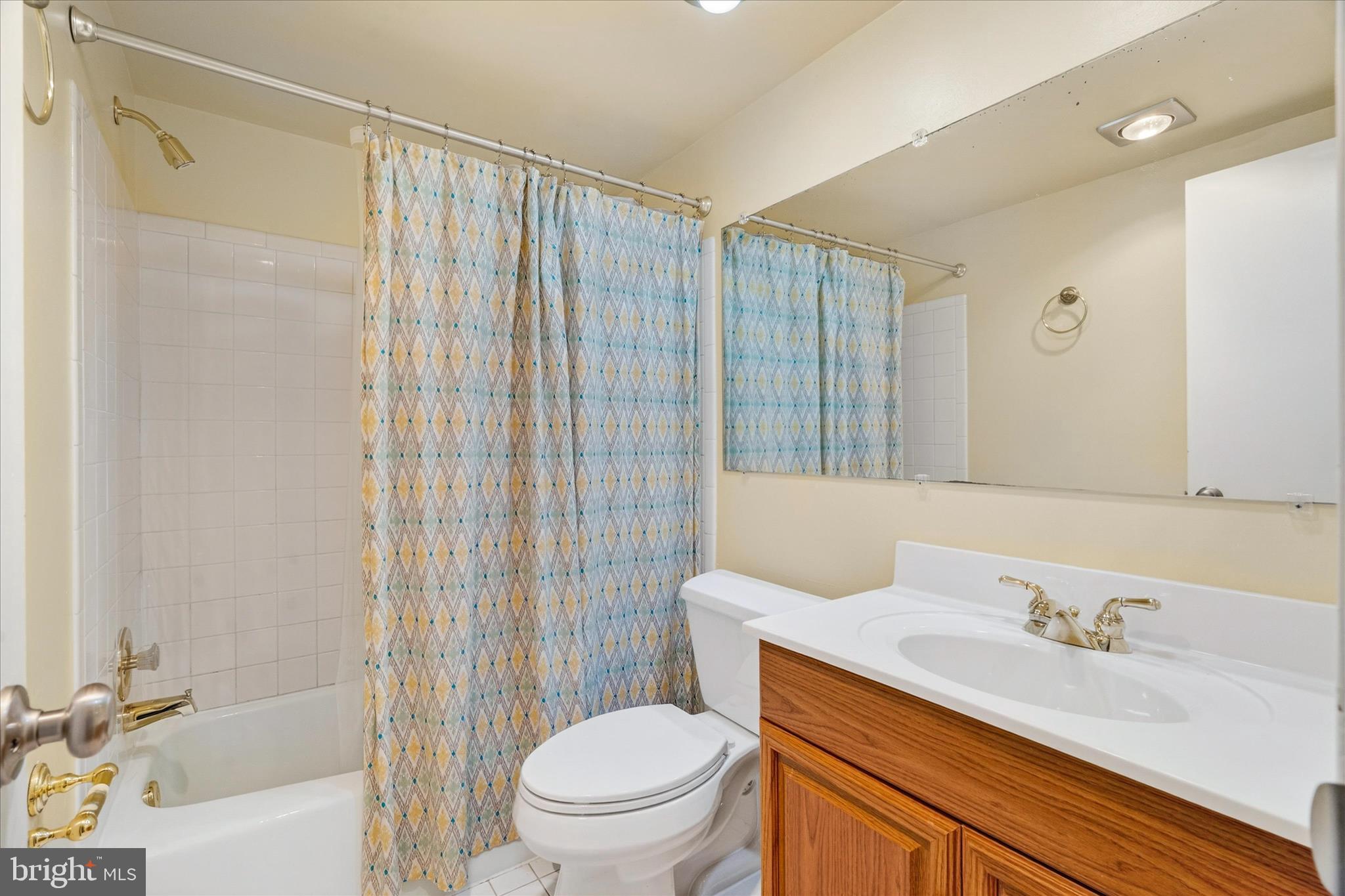 10000 Stedwick Road, Unit 104 Montgomery Village, MD 20886 - Photo 24 of 31 a bathroom with a sink a toilet and shower