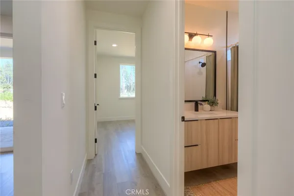 a white toilet sitting next to a bath tub