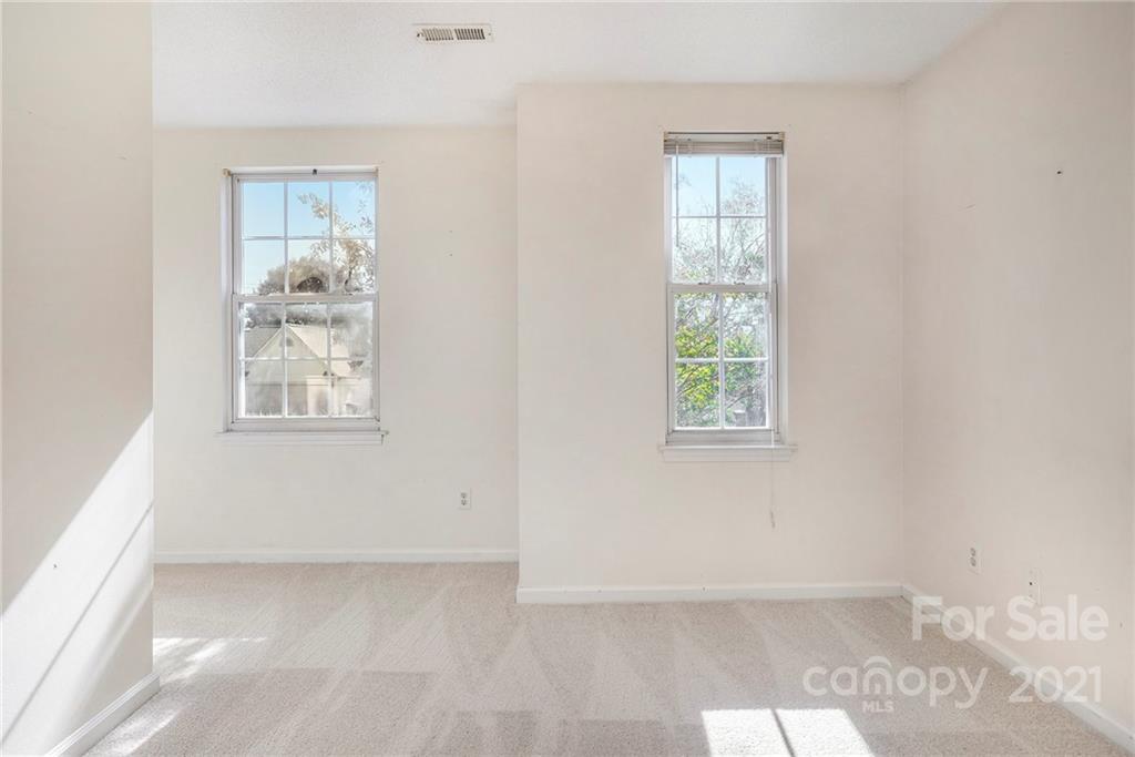 5532 Lemley Road Northwest Concord, NC 28027 - Photo 12 of 18 an empty room with windows