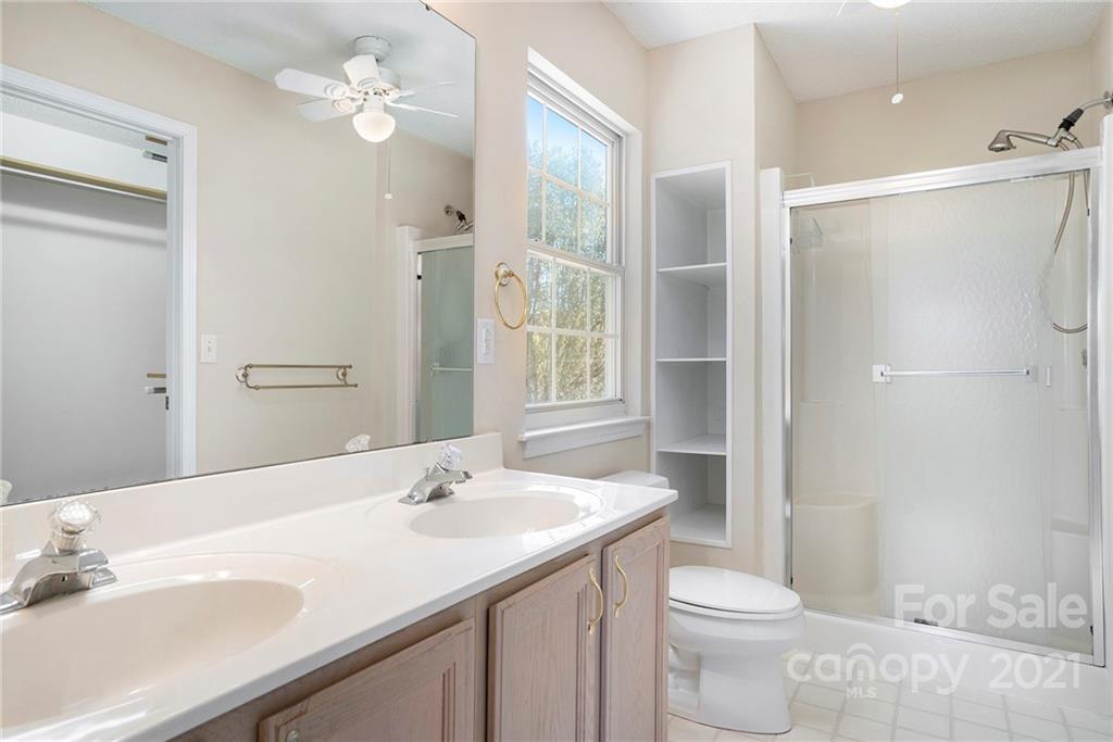 5532 Lemley Road Northwest Concord, NC 28027 - Photo 14 of 18 a bathroom with a sink a toilet and shower