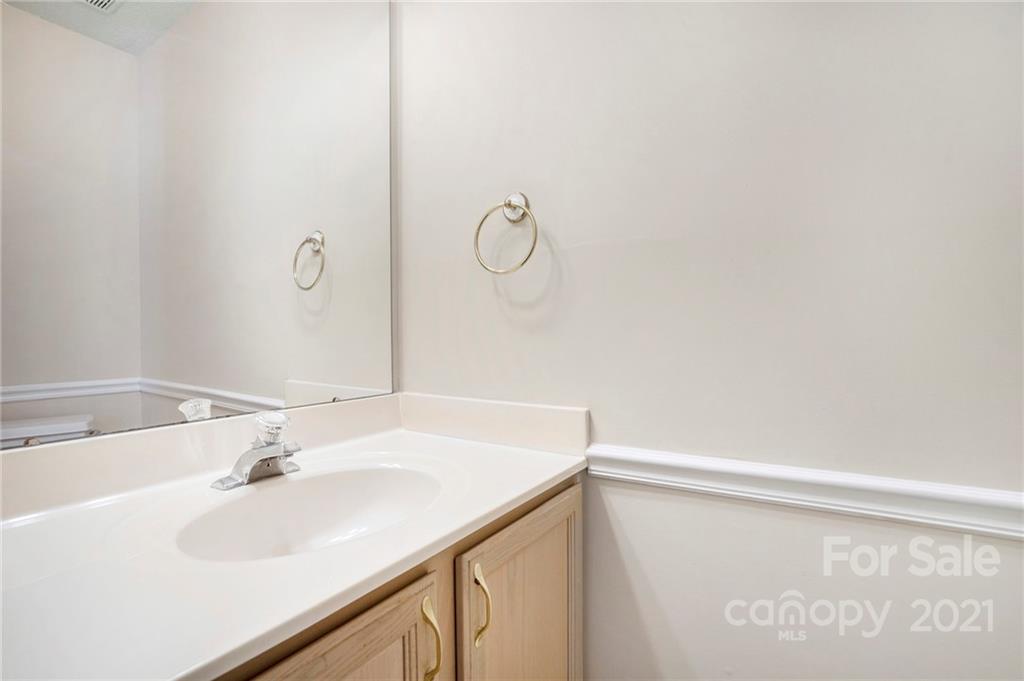 5532 Lemley Road Northwest Concord, NC 28027 - Photo 15 of 18 a bathroom with a sink and a mirror