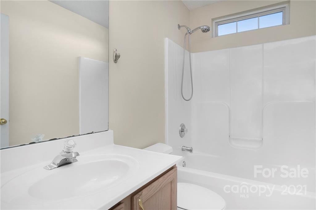 5532 Lemley Road Northwest Concord, NC 28027 - Photo 16 of 18 a bathroom with a sink toilet and shower