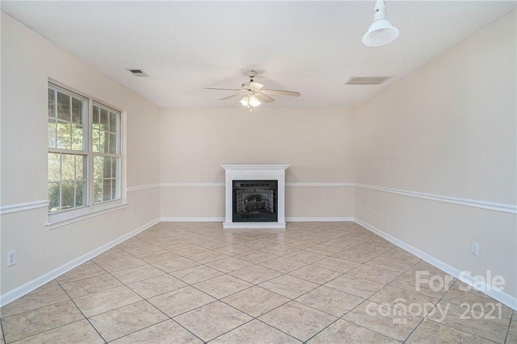 5532 Lemley Road Northwest Concord, NC 28027 - Photo 3 of 18 wooden floor in an empty room with a window