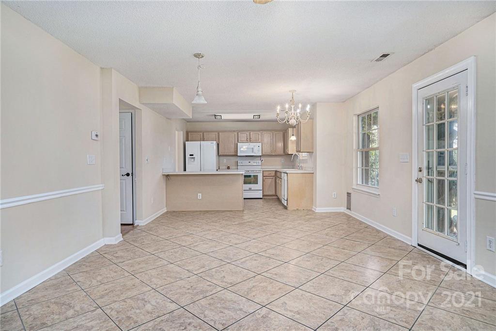 5532 Lemley Road Northwest Concord, NC 28027 - Photo 4 of 18 a view of a kitchen with a sink and windows