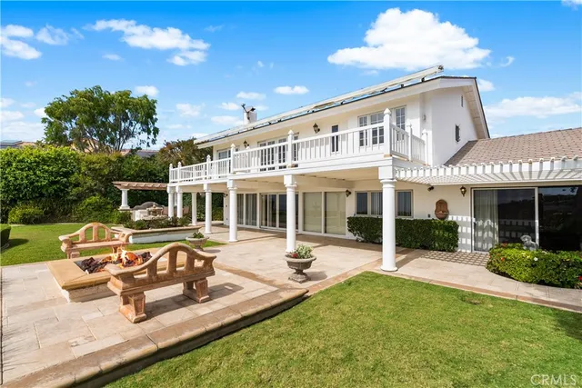 a view of a house with a yard porch and sitting area
