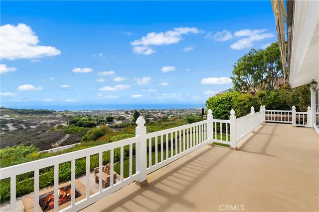 a view of a house with a yard patio and furniture