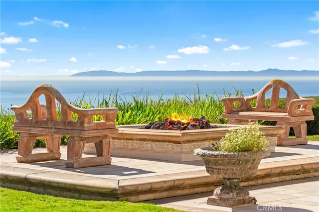 a view of a terrace with a garden and patio