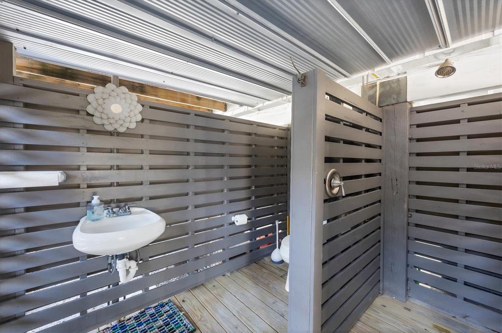 331 Bocilla Drive Boca Grande, FL 33921 - Photo 28 of 34 a bathroom with a sink and a mirror