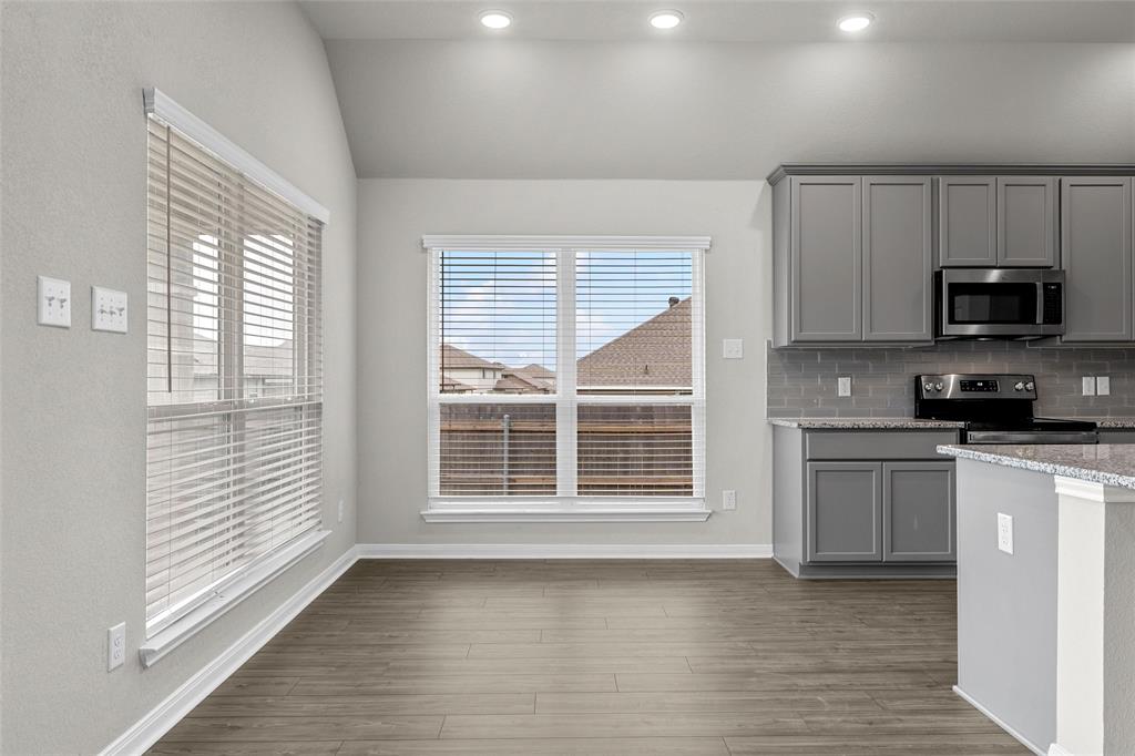 3208 Dottavio Road Lorena, TX 76655 - Photo 14 of 31 Open-concept space featuring wood-finish flooring and recessed lighting