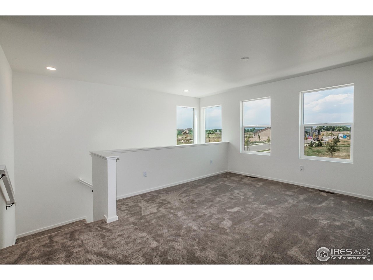 6126 Red Barn Road Fort Collins, CO 80528 - Photo 16 of 36 an empty room with windows and closet