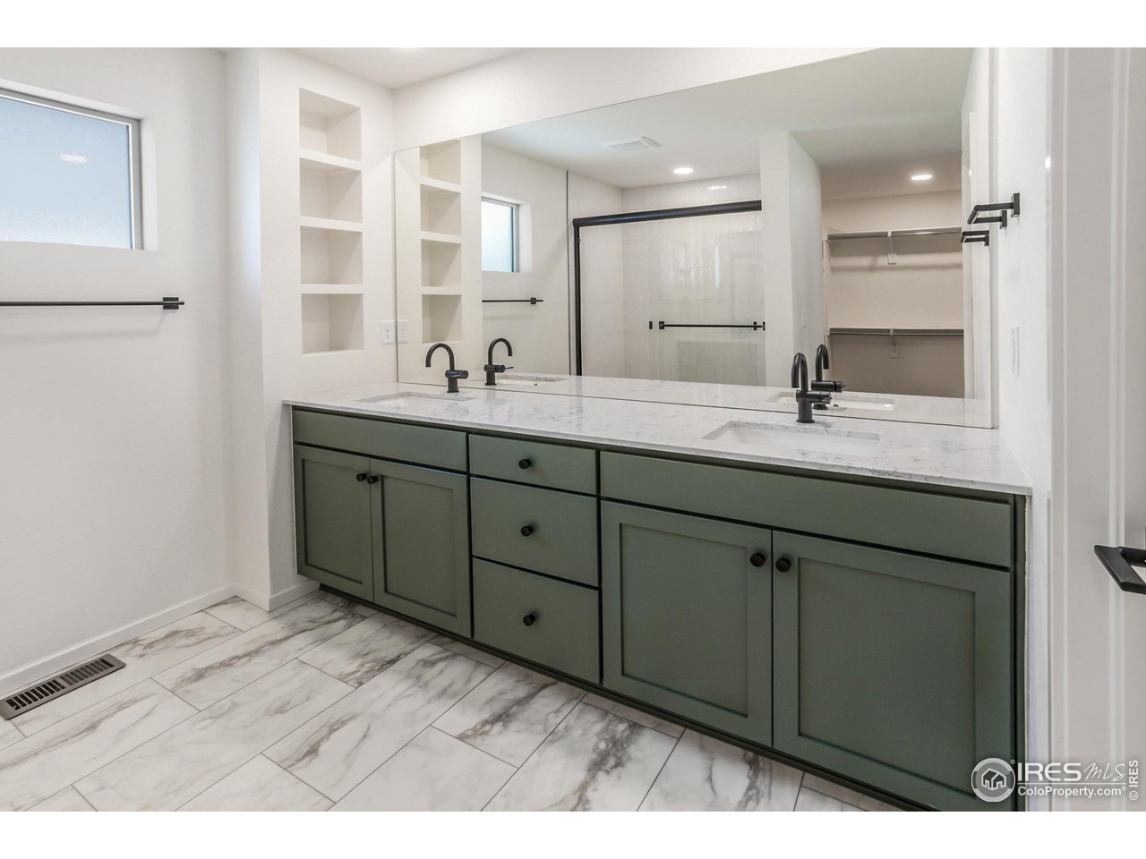 6126 Red Barn Road Fort Collins, CO 80528 - Photo 20 of 36 a bathroom with a double vanity sink and mirror