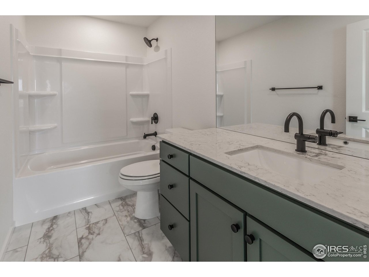 6126 Red Barn Road Fort Collins, CO 80528 - Photo 26 of 36 a bathroom with a sink a toilet and a tub