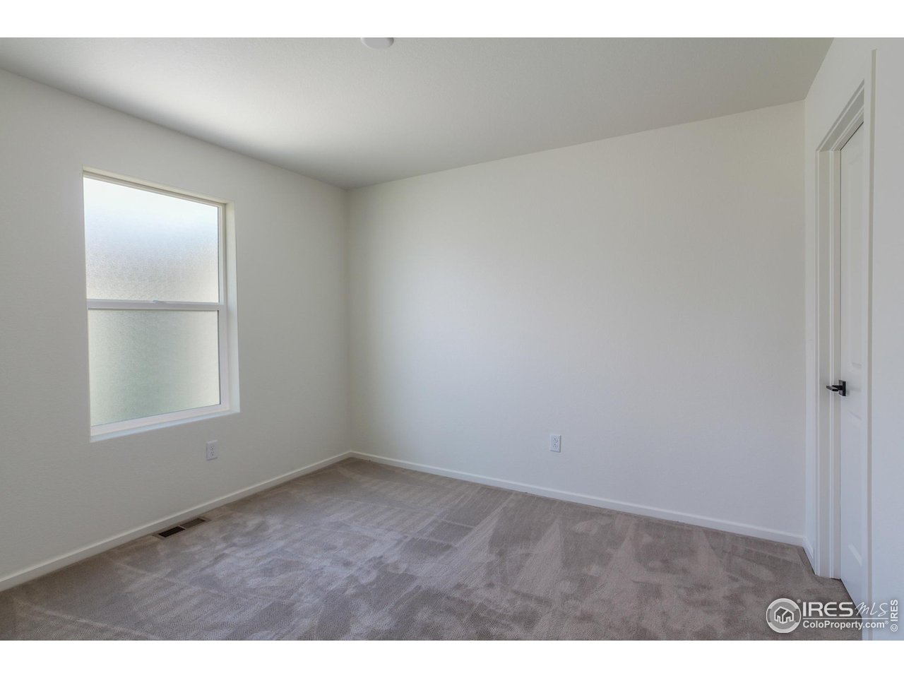 6126 Red Barn Road Fort Collins, CO 80528 - Photo 28 of 36 a view of an empty room with a window