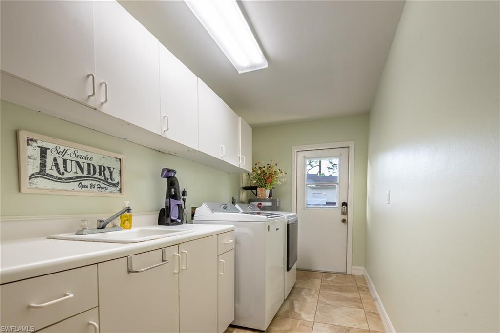 18386 Tulip Road Fort Myers, FL 33967 - Photo 12 of 25 a utility room with sink dryer and washer