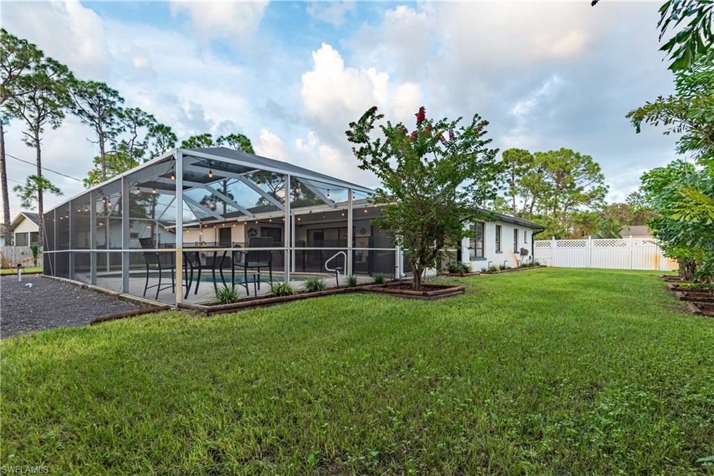 18386 Tulip Road Fort Myers, FL 33967 - Photo 23 of 25 a view of a house with backyard and porch