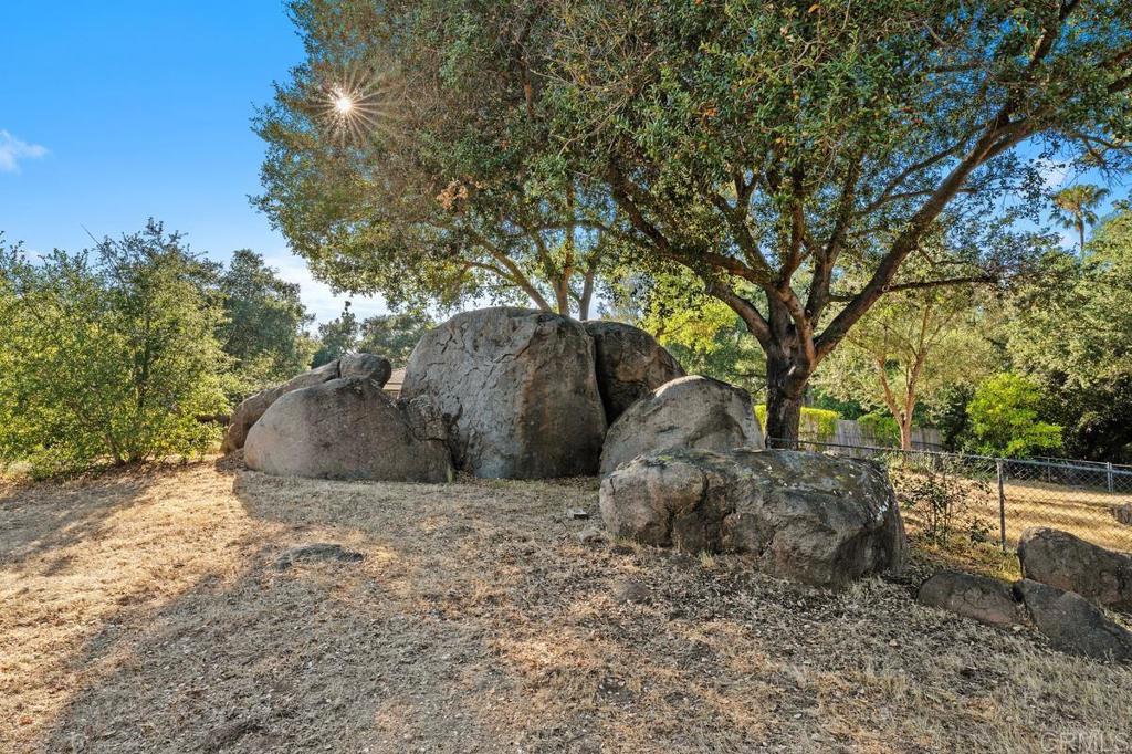 16522 Orchard Bend Road Poway, CA 92064 - Photo 19 of 26 a view of a wooden house with large trees